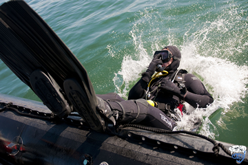 What is the difference between a wet suit and a dry suit