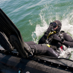 What is the difference between a wet suit and a dry suit